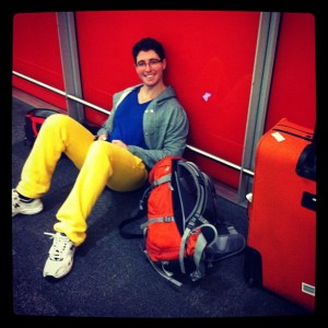 Waiting for luggage at the airport. Too tired to stand.